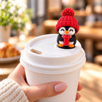 Coffee Lover Penguin with red hat on a coffee cup lid