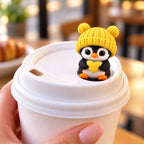 Sweetheart Penguin with yellow hat on a coffee cup lid